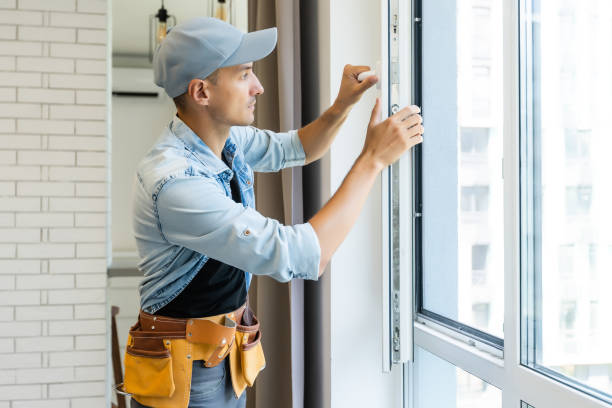 young handyman male worker repair window.
